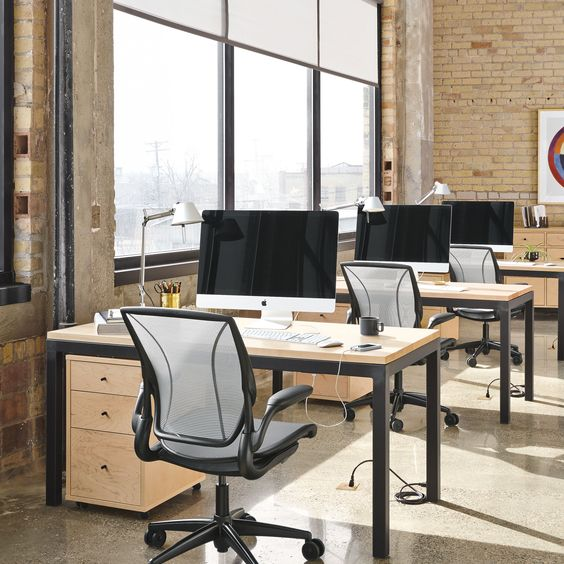 an open plan office with individual desks