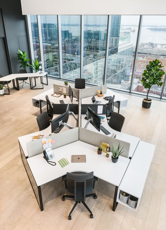 an open plan office with dividers between desks
